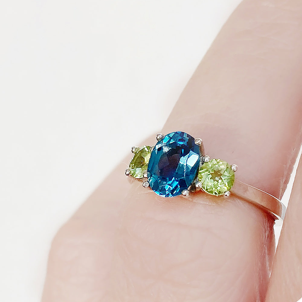 Lucy, a London Blue Topaz and Peridot Trilogy Ring - Victoria's Jewellery