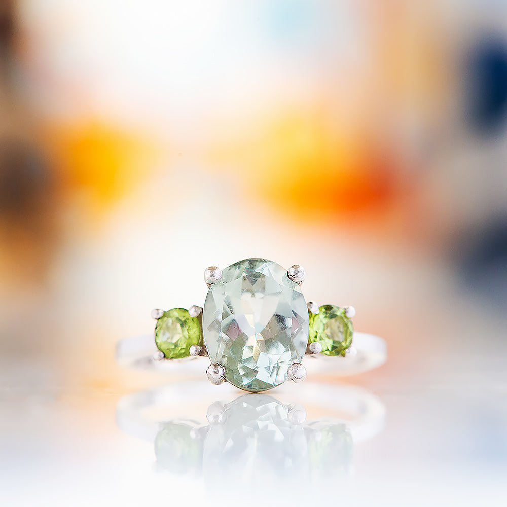 Hallie, an Oval cut Prasiolite and Peridot Trilogy Ring