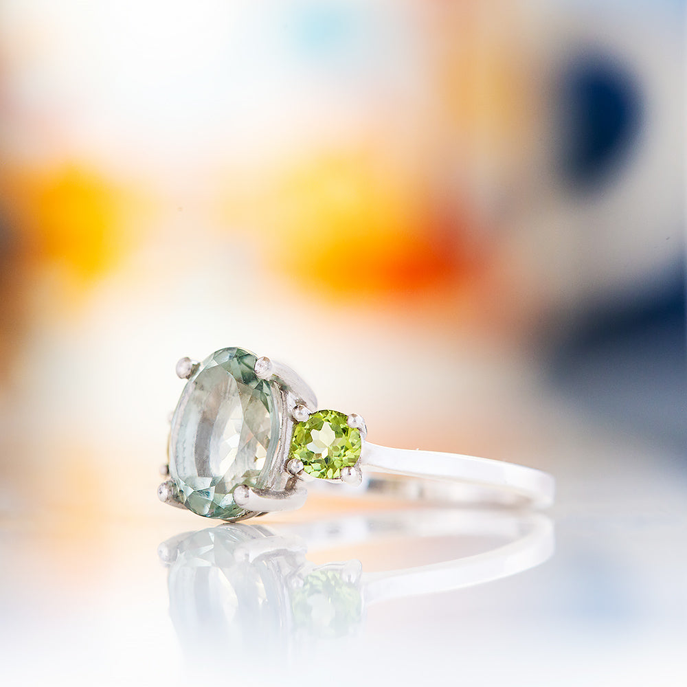 Hallie, an Oval cut Prasiolite and Peridot Trilogy Ring