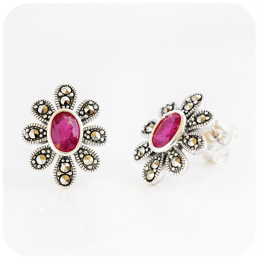 oval cut ruby stud earrings in a vintage flower design