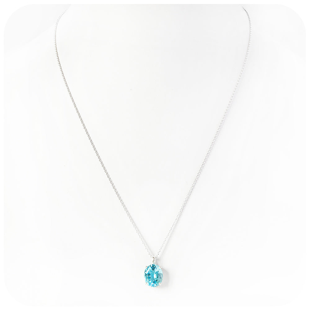 Lana, an Oval cut Sky Blue Topaz Pendant and Chain