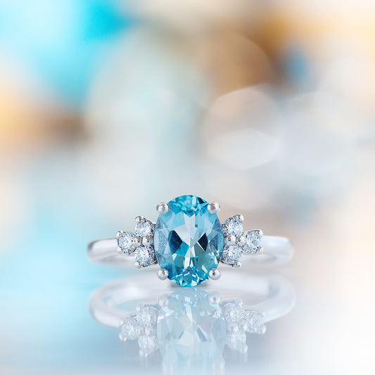 Este, an Oval cut Sky Blue Topaz and Lab Diamond Ring