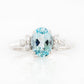 Este, an Oval cut Sky Blue Topaz and Lab Diamond Ring