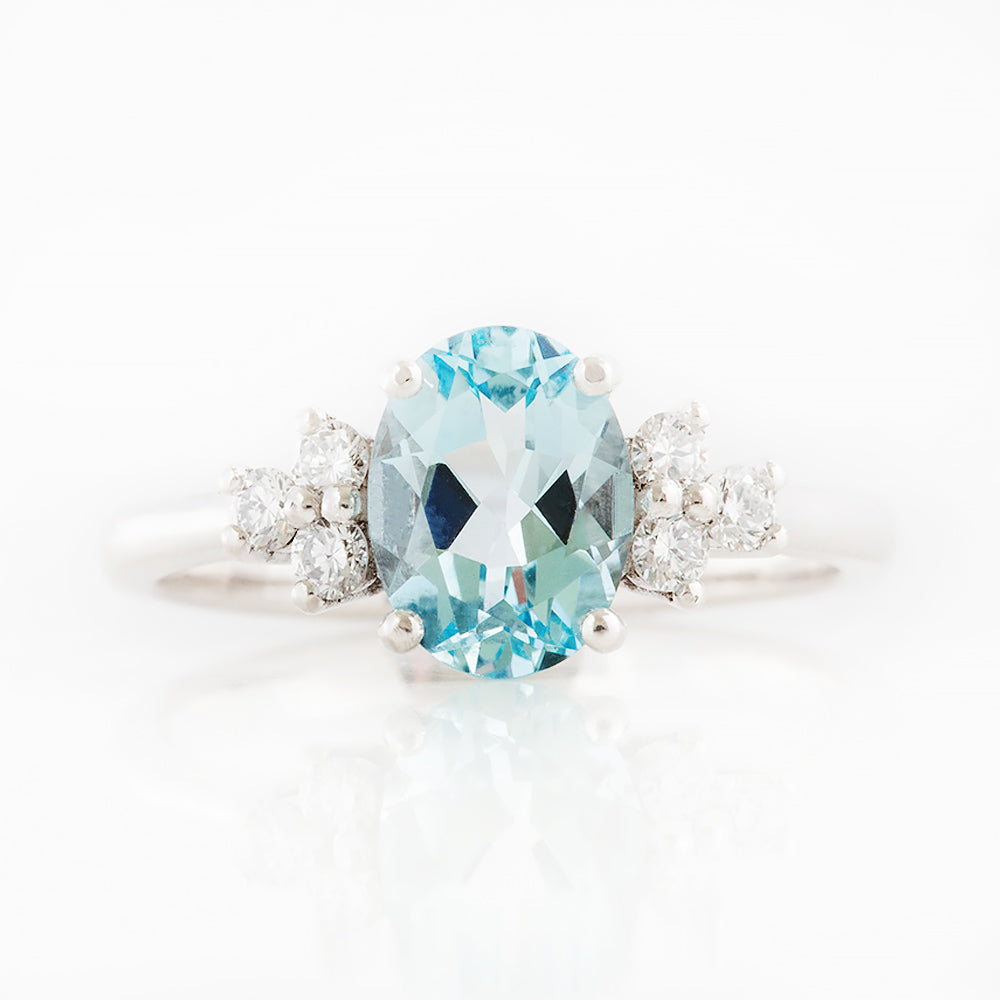 Este, an Oval cut Sky Blue Topaz and Lab Diamond Ring