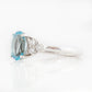 Este, an Oval cut Sky Blue Topaz and Lab Diamond Ring