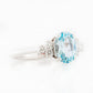 Este, an Oval cut Sky Blue Topaz and Lab Diamond Ring