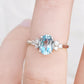 Este, an Oval cut Sky Blue Topaz and Lab Diamond Ring