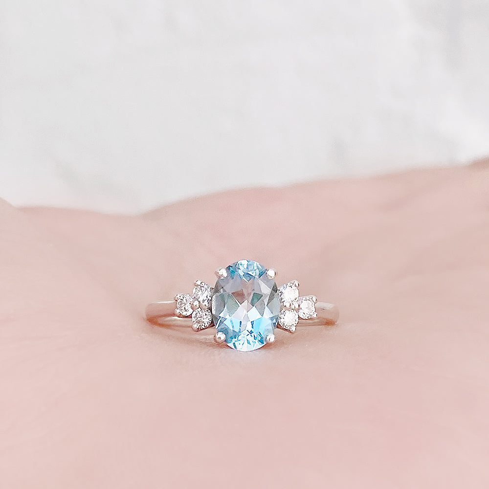 Este, an Oval cut Sky Blue Topaz and Lab Diamond Ring