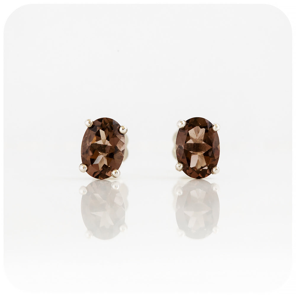 oval cut brown smoky quartz stud earrings in sterling silver