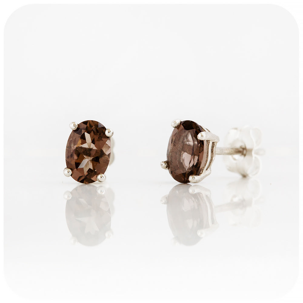 oval cut brown smoky quartz stud earrings in sterling silver