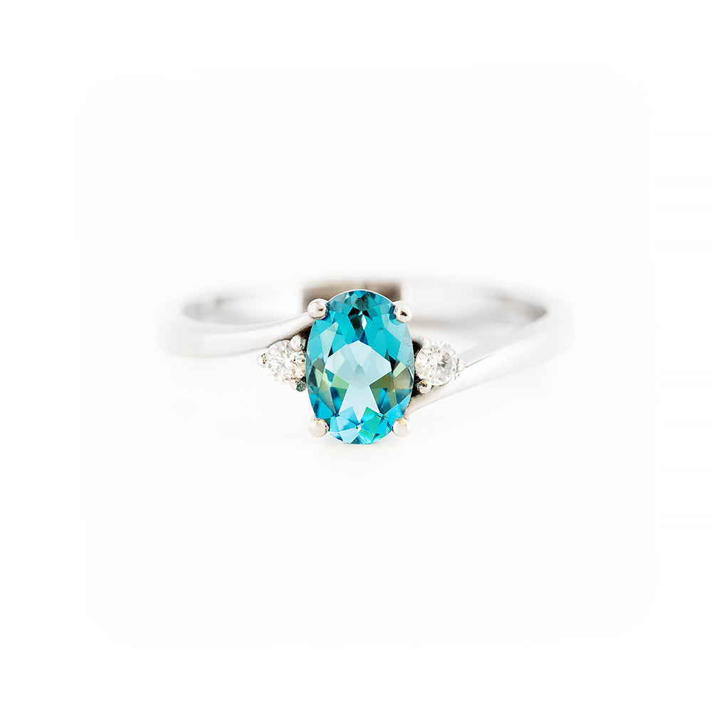 Oval cut Swiss Blue Topaz and Lab Diamond Trilogy Engagement Ring in White Gold - Victoria's Jewellery