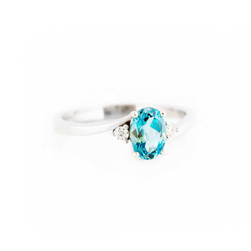 Oval cut Swiss Blue Topaz and Lab Diamond Trilogy Engagement Ring in White Gold - Victoria's Jewellery