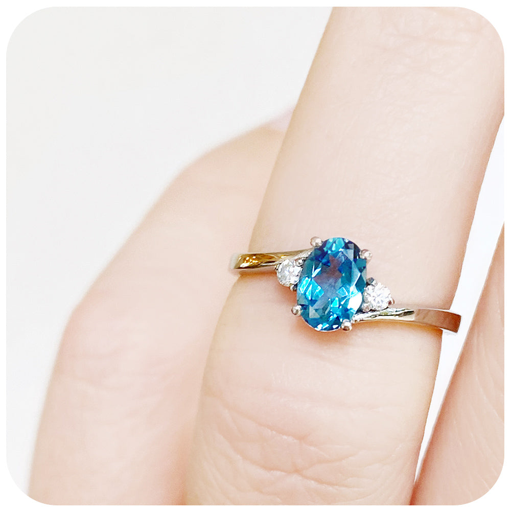 Oval cut Swiss Blue Topaz and Lab Diamond Trilogy Engagement Ring in White Gold - Victoria's Jewellery