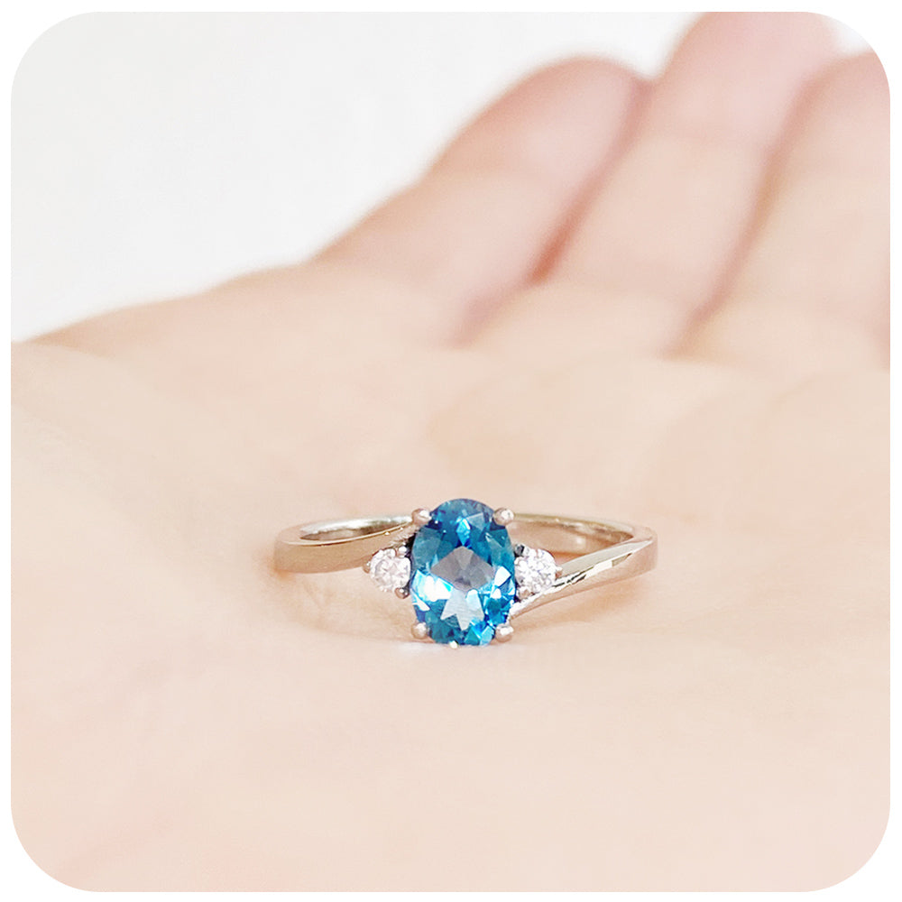 Oval cut Swiss Blue Topaz and Lab Diamond Trilogy Engagement Ring in White Gold - Victoria's Jewellery