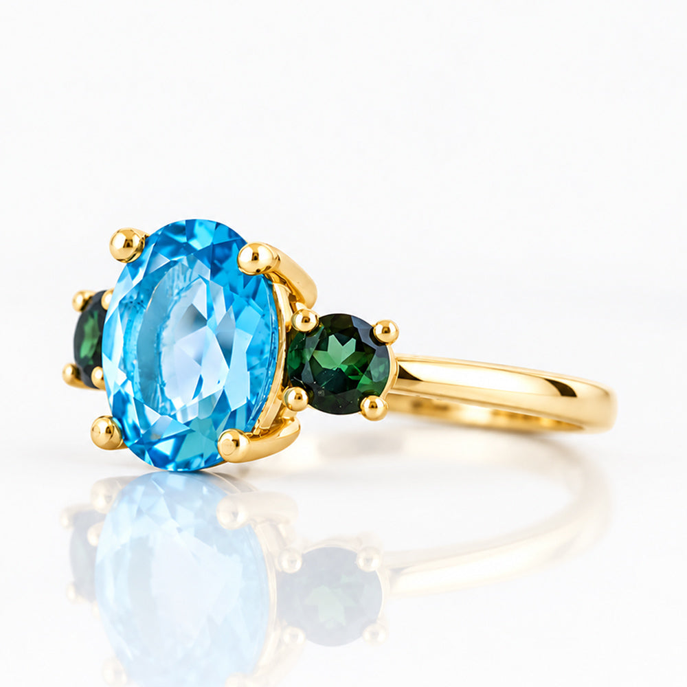 Hallie, a Topaz and Green Tourmaline Oval Trilogy Ring - Victoria's Jewellery