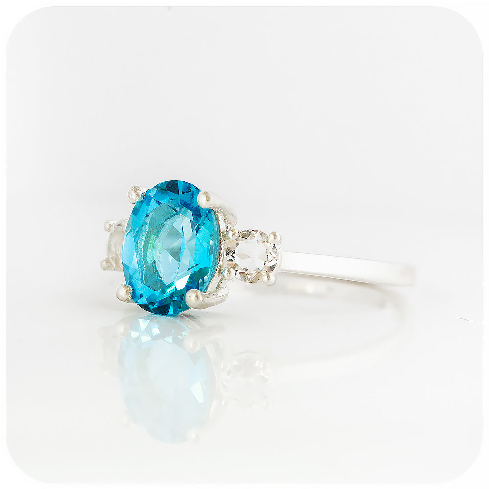 Oval cut Swiss Blue Topaz and White Quartz Trilogy Anniversary Ring - Victoria's Jewellery