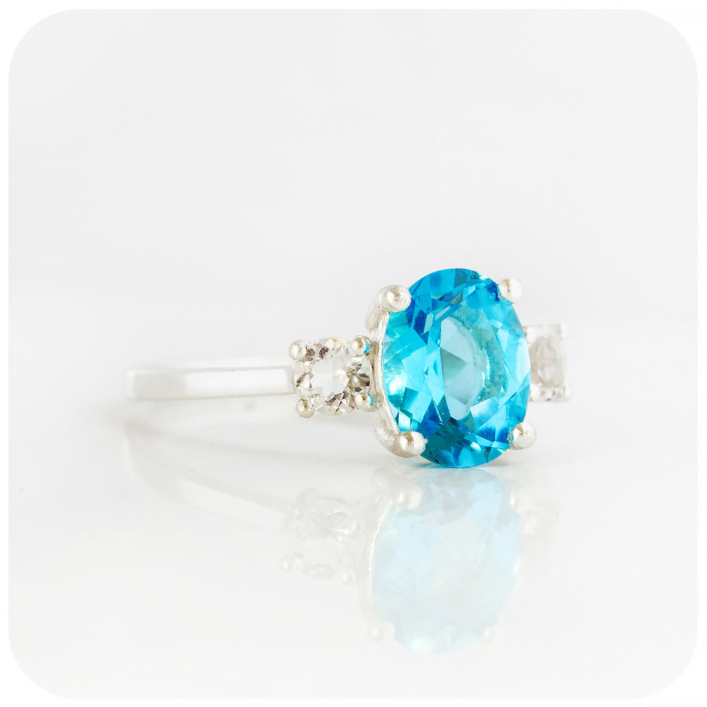 Oval cut Swiss Blue Topaz and White Quartz Trilogy Anniversary Ring - Victoria's Jewellery