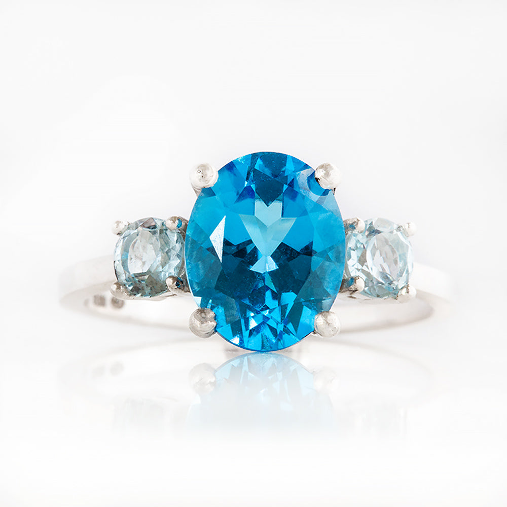 Hallie, an Oval cut Swiss Blue and Sky Blue Topaz Trilogy Ring