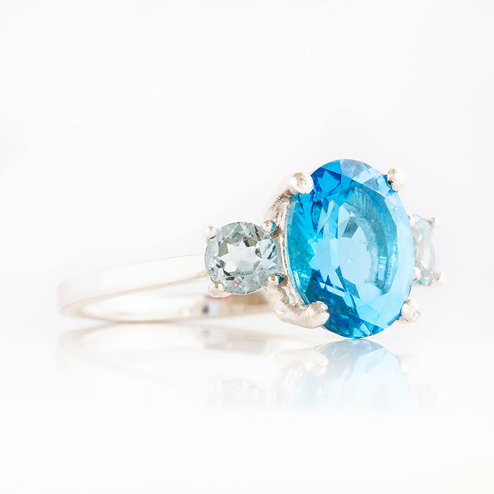 Hallie, an Oval cut Swiss Blue and Sky Blue Topaz Trilogy Ring