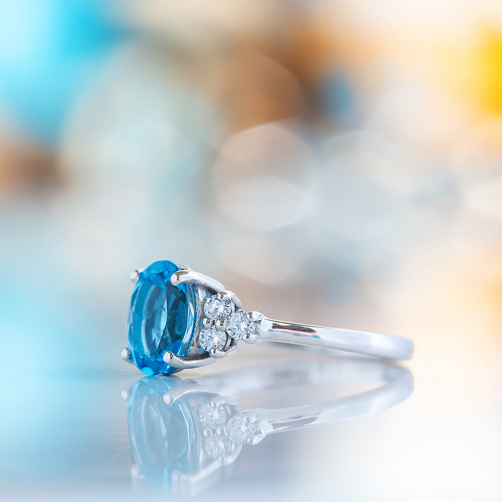 Este, an Oval cut Swiss Topaz and Lab Diamond Ring