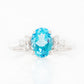 Este, an Oval cut Swiss Topaz and Lab Diamond Ring