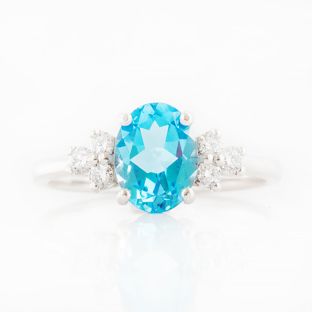 Este, an Oval cut Swiss Topaz and Lab Diamond Ring
