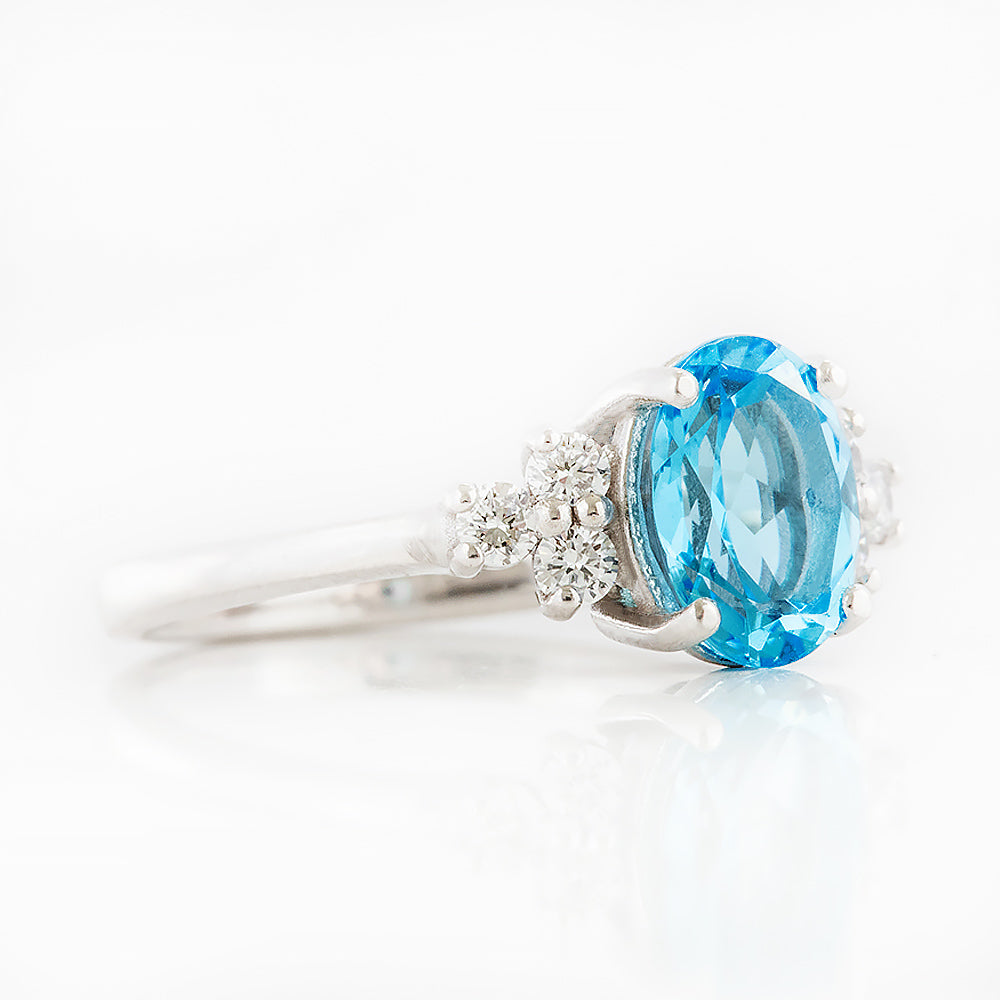Este, an Oval cut Swiss Topaz and Lab Diamond Ring