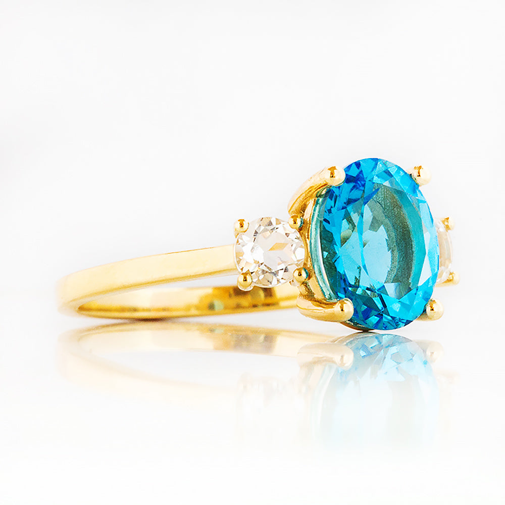 Hallie, a Swiss Blue Topaz and Clear Quartz Trilogy Ring - Victoria's Jewellery