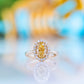 Tilana, an Oval cut Yellow Diamond Halo Engagement Ring - 1.5ct
