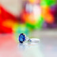 Georgie, a Blue Sapphire and Diamond Trilogy Ring - 8x6mm