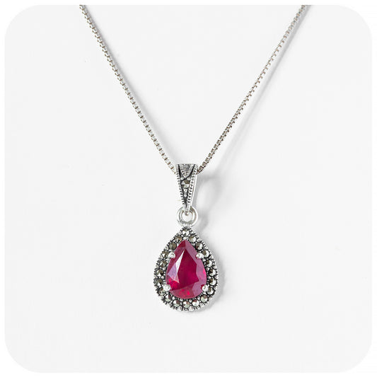 Pear cut Ruby Halo Pendant in Sterling Silver