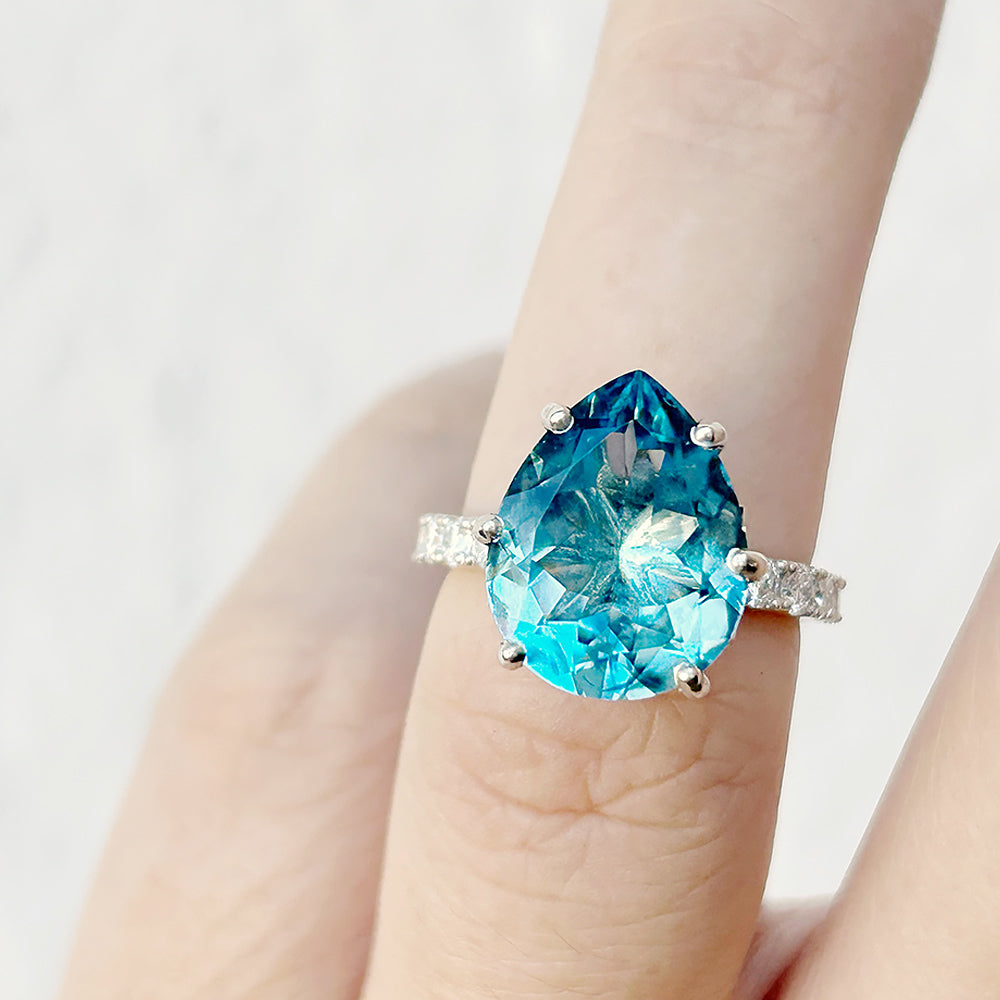 René, a Sky Blue Topaz and Lab Diamond Ring