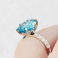 René, a Sky Blue Topaz and Lab Diamond Ring