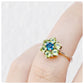 round cut peridot and london blue topaz flower design ring 