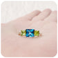 Princess cut London Blue Topaz and Peridot Trilogy Ring - Victoria's Jewellery