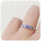 round cut tanzanite half eternity ring with graduated stones - Victoria's Jewellery