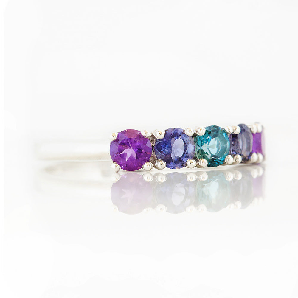 Annie, a Blue and Purple Half Eternity Ring