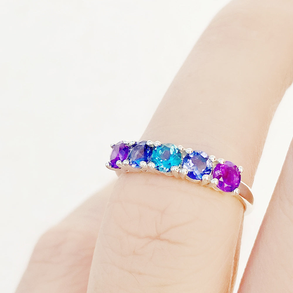 Annie, a Blue and Purple Half Eternity Ring