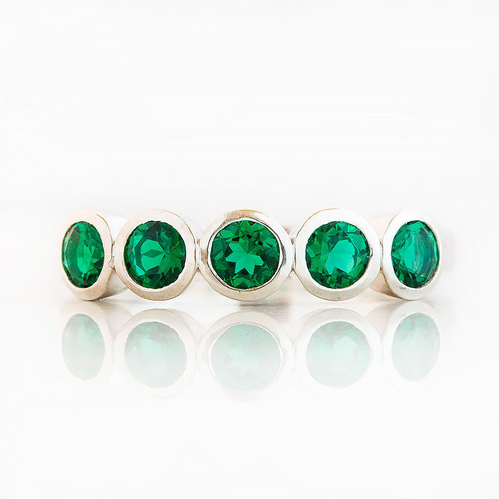 Violet, a Lab Emerald Bezel Set Half Eternity Ring