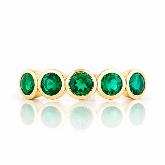 Violet, a Lab Emerald Bezel Set Half Eternity Ring