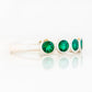Violet, a Lab Emerald Bezel Set Half Eternity Ring