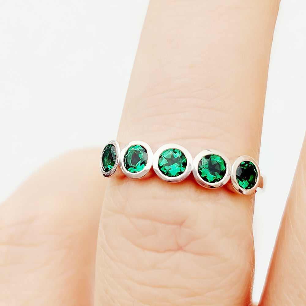 Violet, a Lab Emerald Bezel Set Half Eternity Ring