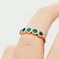 Violet, a Lab Emerald Bezel Set Half Eternity Ring