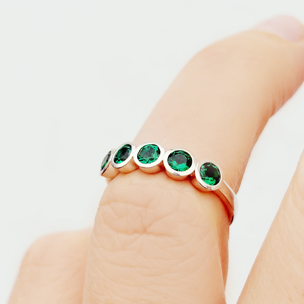 Violet, a Lab Emerald Bezel Set Half Eternity Ring