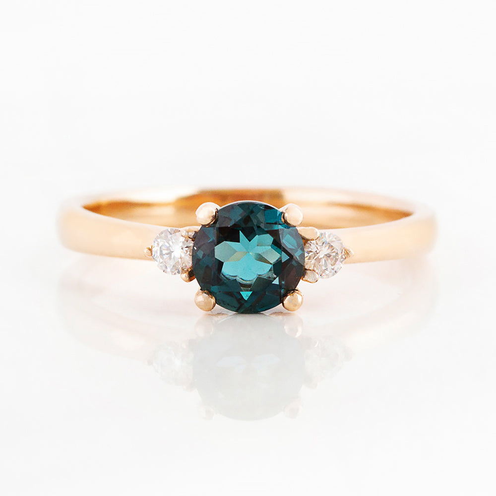 Round cut London Blue Topaz and Diamond Trilogy Engagement Ring in Rose Gold - Victoria's Jewellery