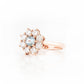 Fleur, a Moissanite and Topaz Flower Cluster Ring