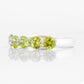Danelle, a Peridot Half Eternity Trellis Ring