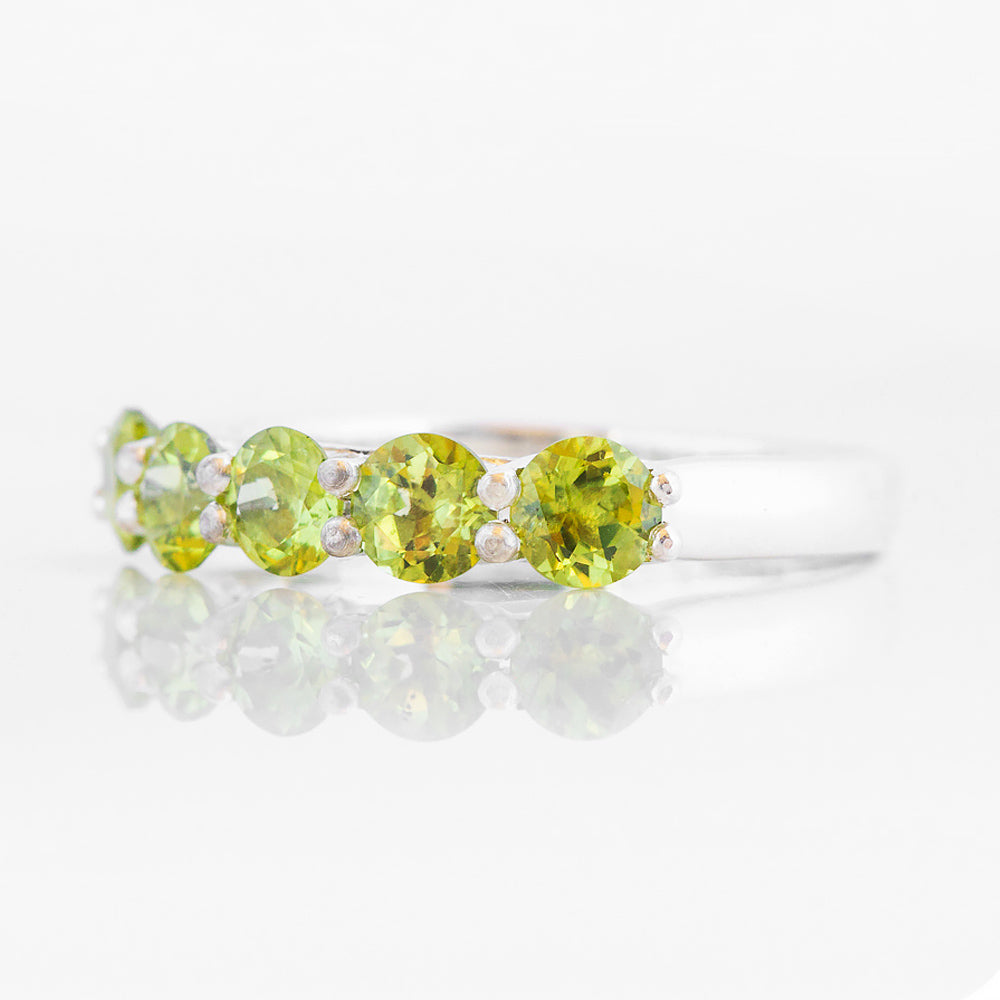 Danelle, a Peridot Half Eternity Trellis Ring