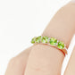 Danelle, a Peridot Half Eternity Trellis Ring