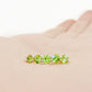 Danelle, a Peridot Half Eternity Trellis Ring